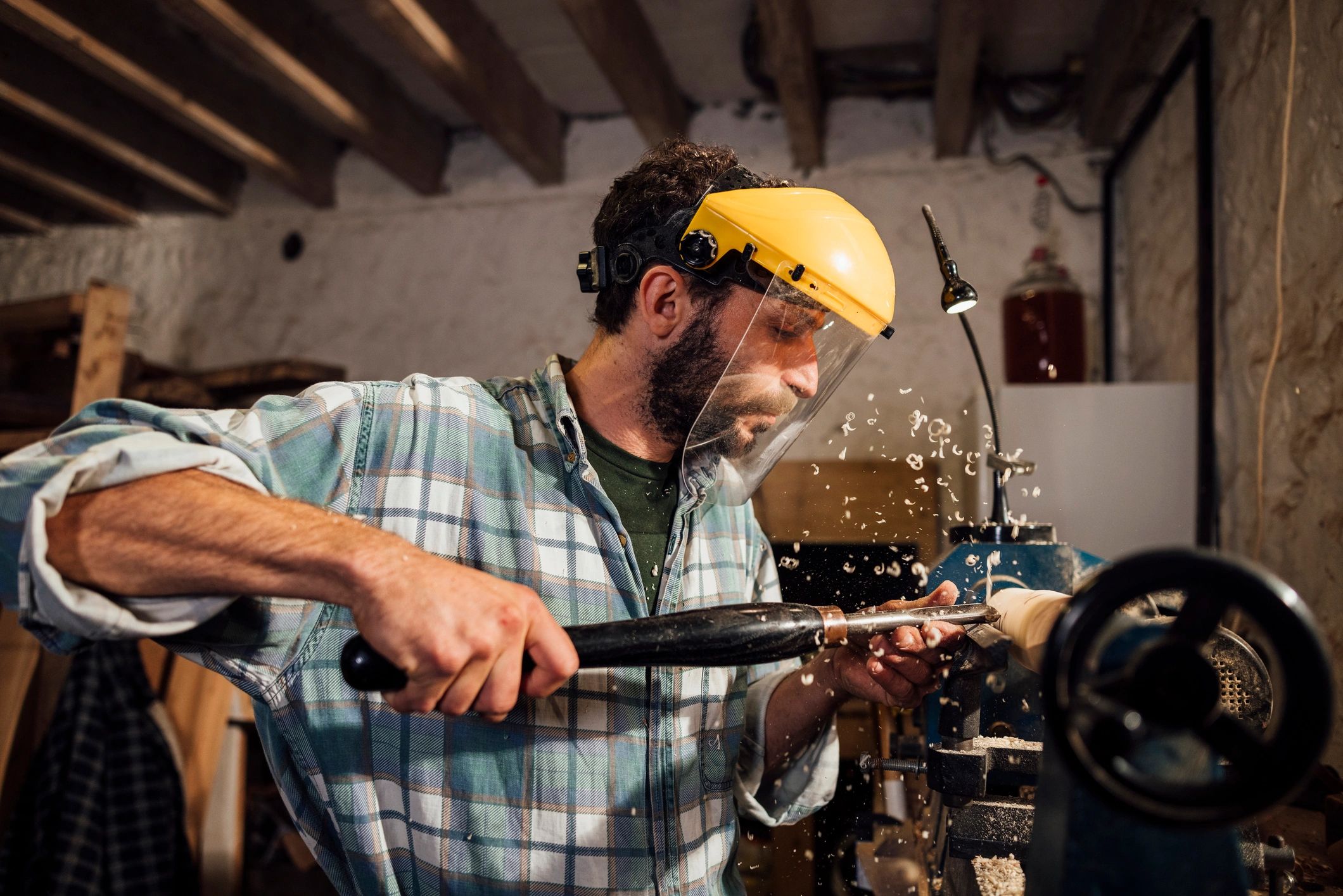 Skilled craftsperson working with precision in a workshop