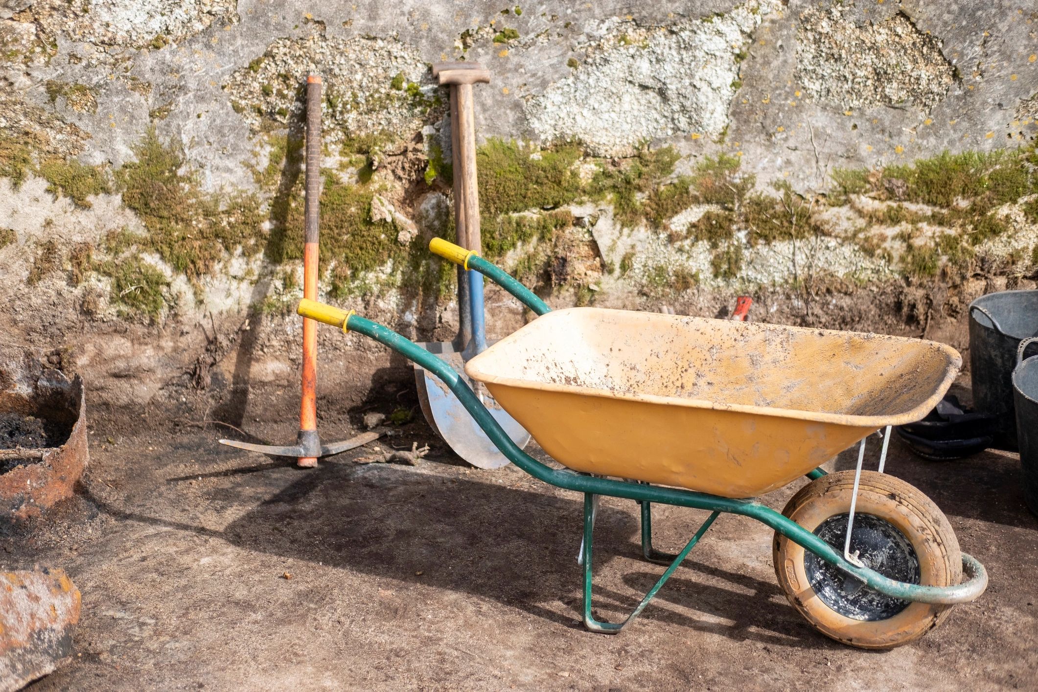 Garden tools and wheelbarrow ready for outdoor work