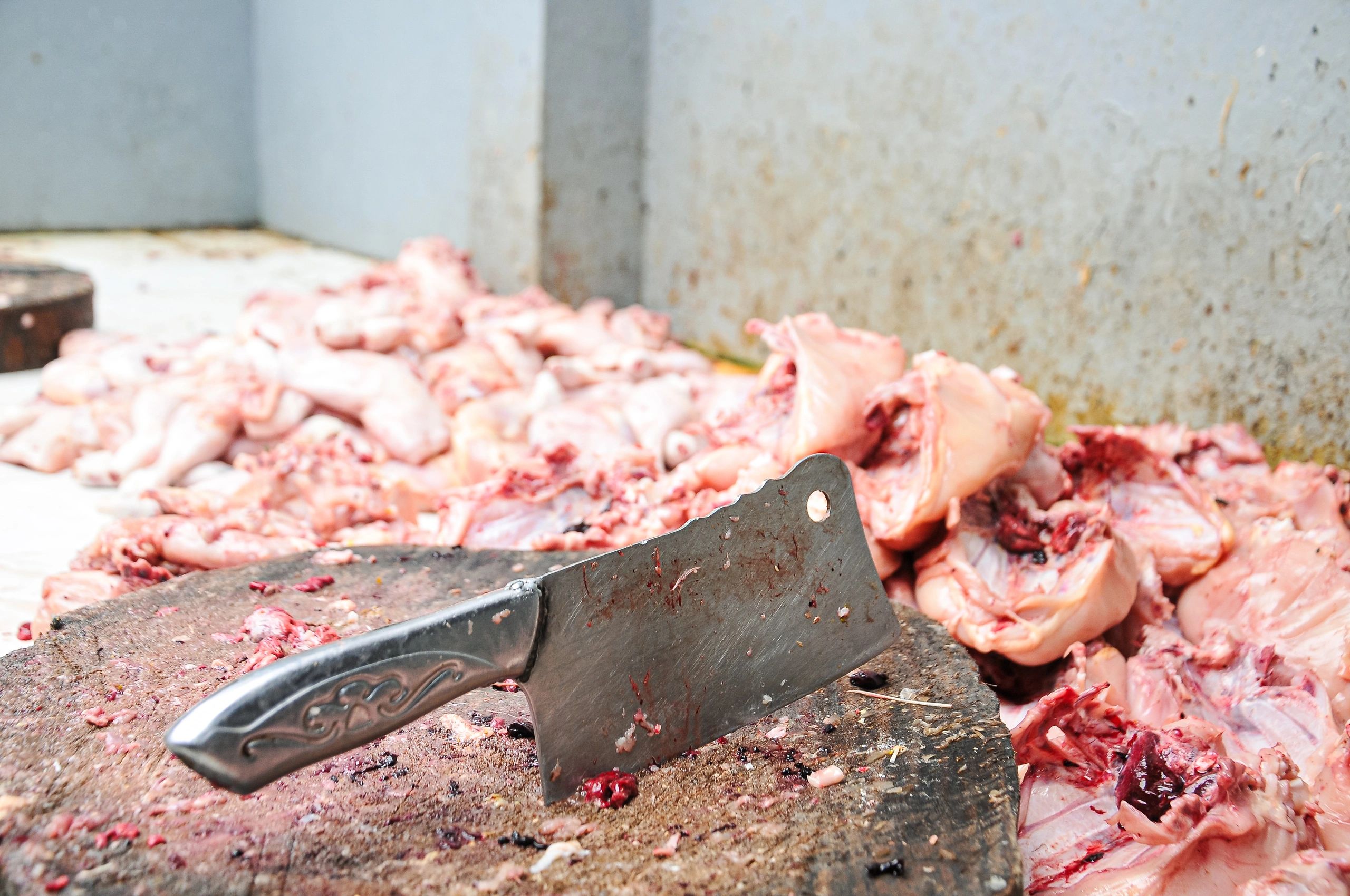 Butcher cleaver on a wooden cutting board